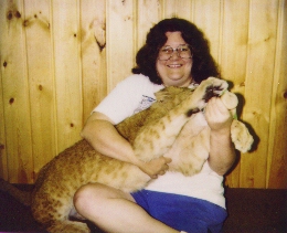 [Audrey feeding a lion cub]